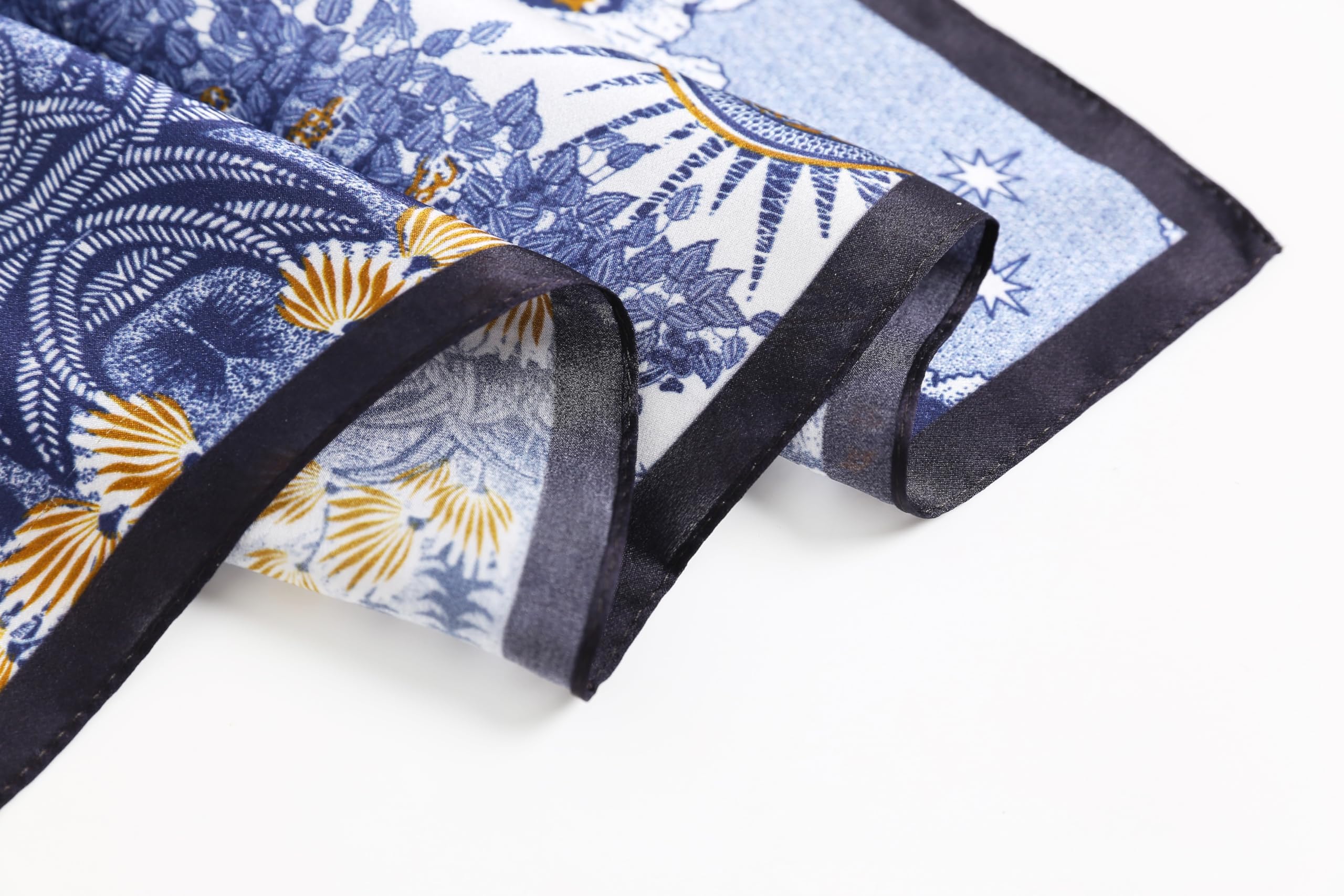 Close-up of gold and blue engraved foliage rolling over the black border