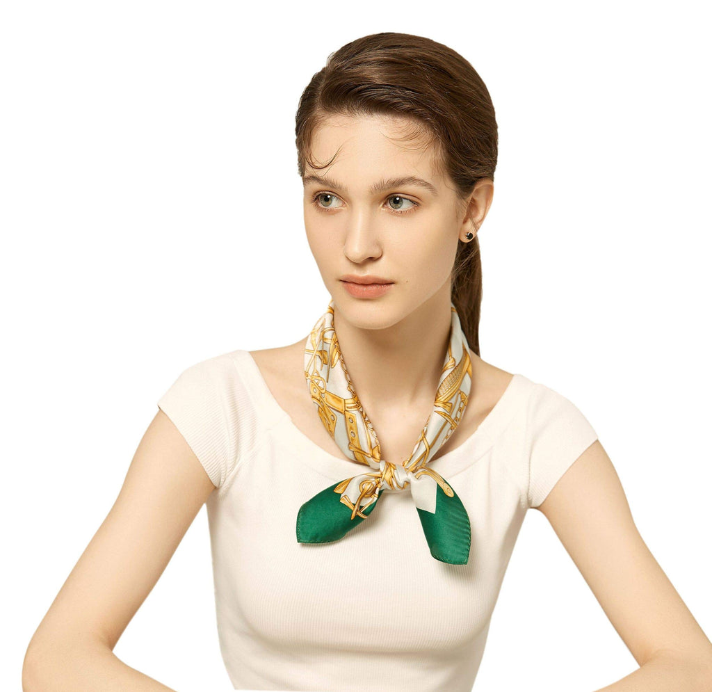 Model in a cream tee with the ivory and gold bridle-print square knotted at her throat