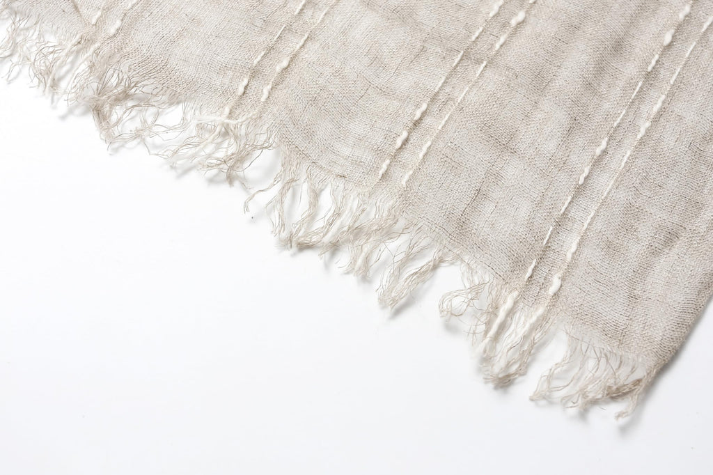 Slub stripe linen scarf open across the shoulders as a wide wrap