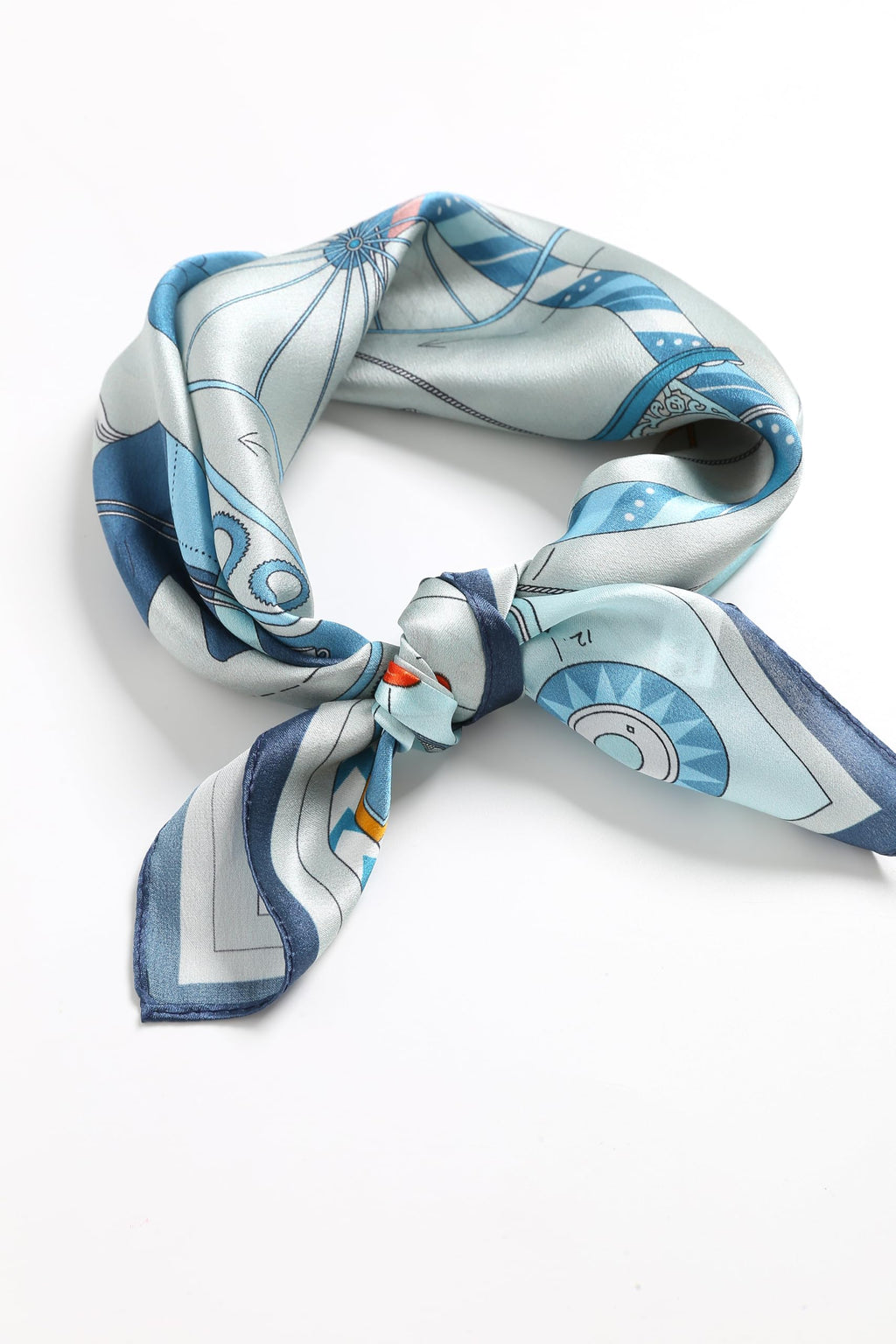 Pale blue story-print square knotted into a ring, navy border along the folds