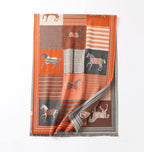 The same shawl laid flat full length with one corner turned back to show the grey striped reverse