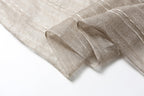 Detail of the softly frayed self fringe at the end of the slub stripe linen scarf
