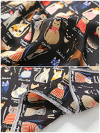 Two detail views of the cat print silk: painted cats with script names and the grey hem