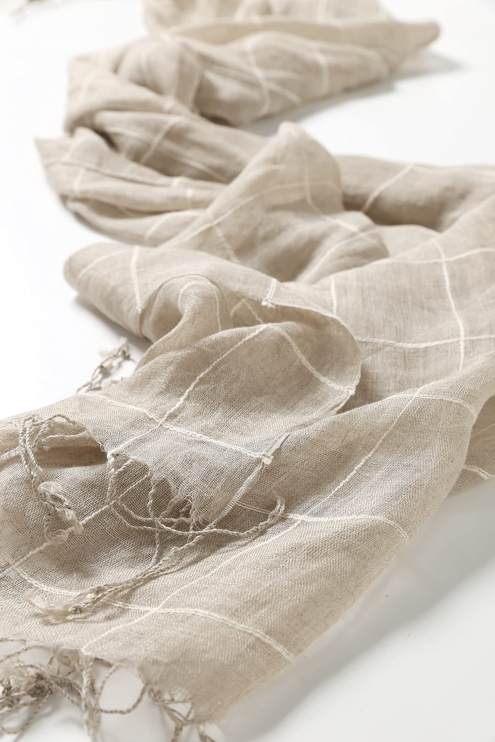 Plaid linen scarf open across the shoulders as a light wrap
