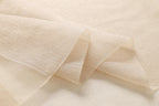 Close up of the sheer champagne fabric folds