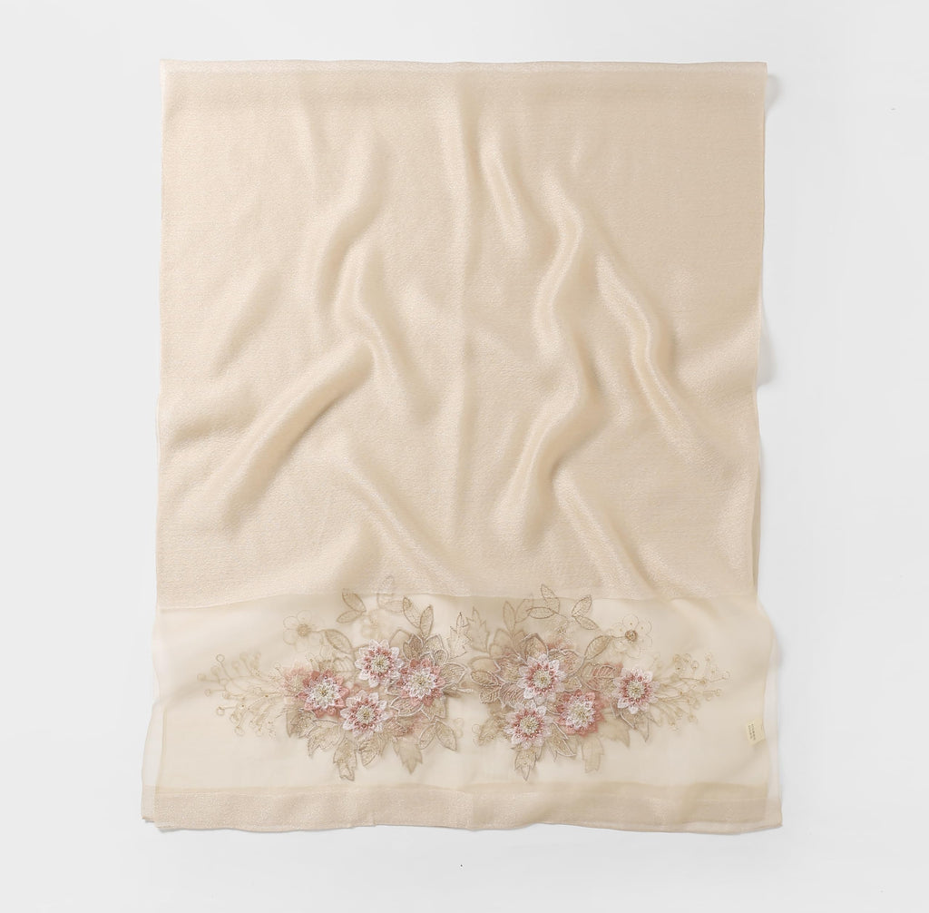 Champagne shawl folded flat showing full width with the beaded bouquet band