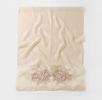 Champagne shawl folded flat showing full width with the beaded bouquet band