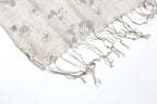 Ink floral linen scarf folded showing the print scale