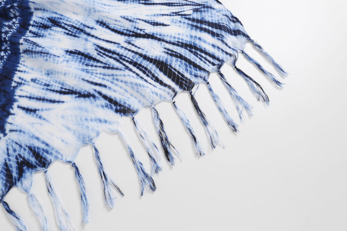 Detail of the Jeelow indigo batik scarf edge, white fringe against the blue and white tie dyed rays