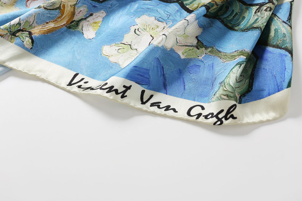 Close up of the Vincent Van Gogh signature printed along the edge of the silk scarf