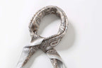 Cream paisley square coiled at the neck with the two grey-edged tails twisted together