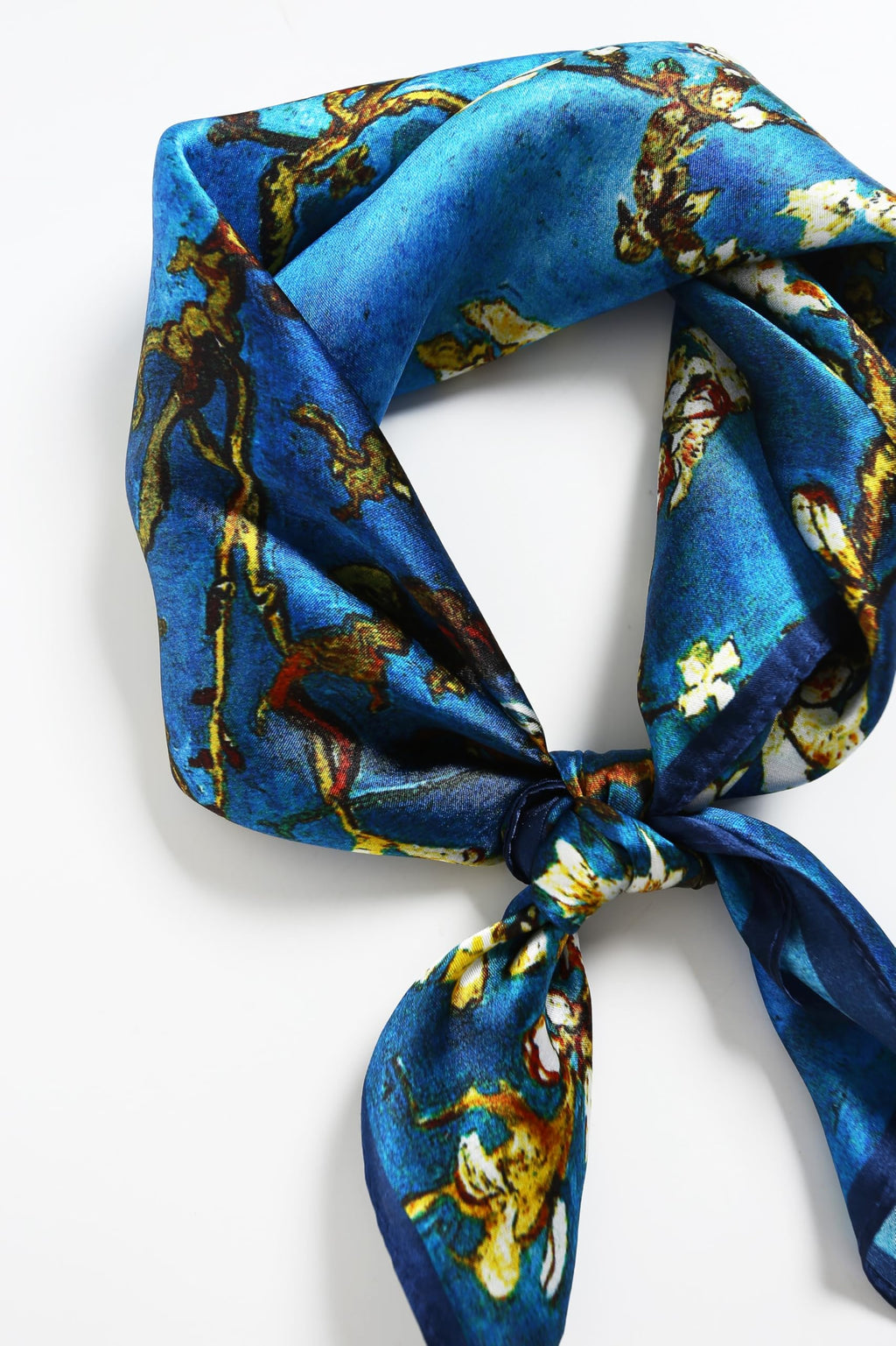 Almond-blossom square coiled at the neck and knotted, tails falling below