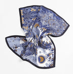 Toile square spread with corners lifted, crescent moon medallion in the lower corner