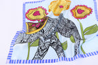 The elephant panel across soft folds of pale blue silk, blue striped border below