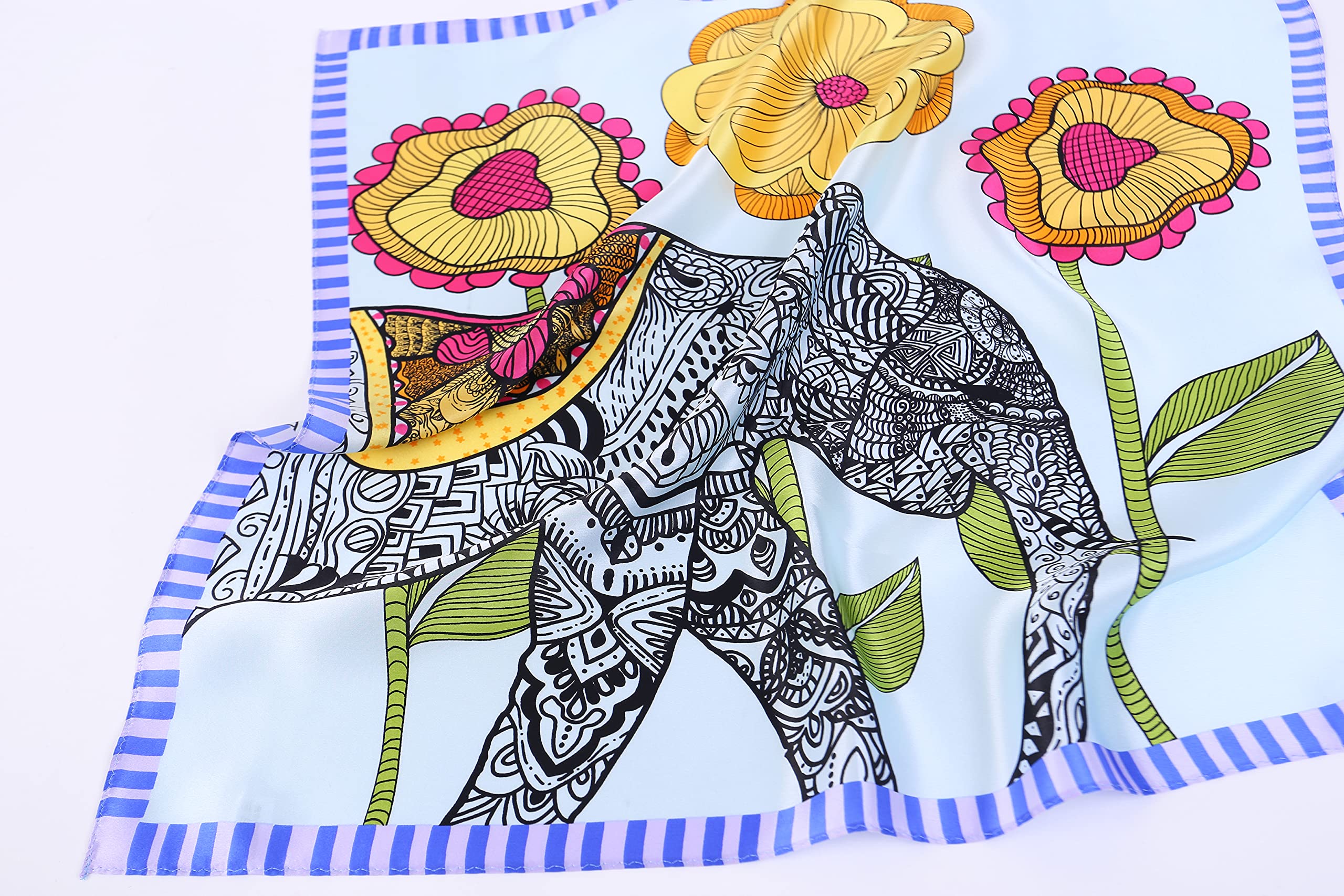 The elephant panel across soft folds of pale blue silk, blue striped border below