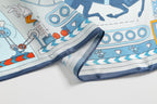 Edge detail, the navy border band and rolled hem beside blue machinery drawings