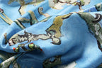Detail of the painted branches and visible brush texture on the almond blossom silk scarf