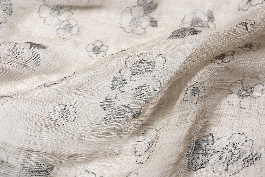 Ink floral linen scarf styled with a loose knot