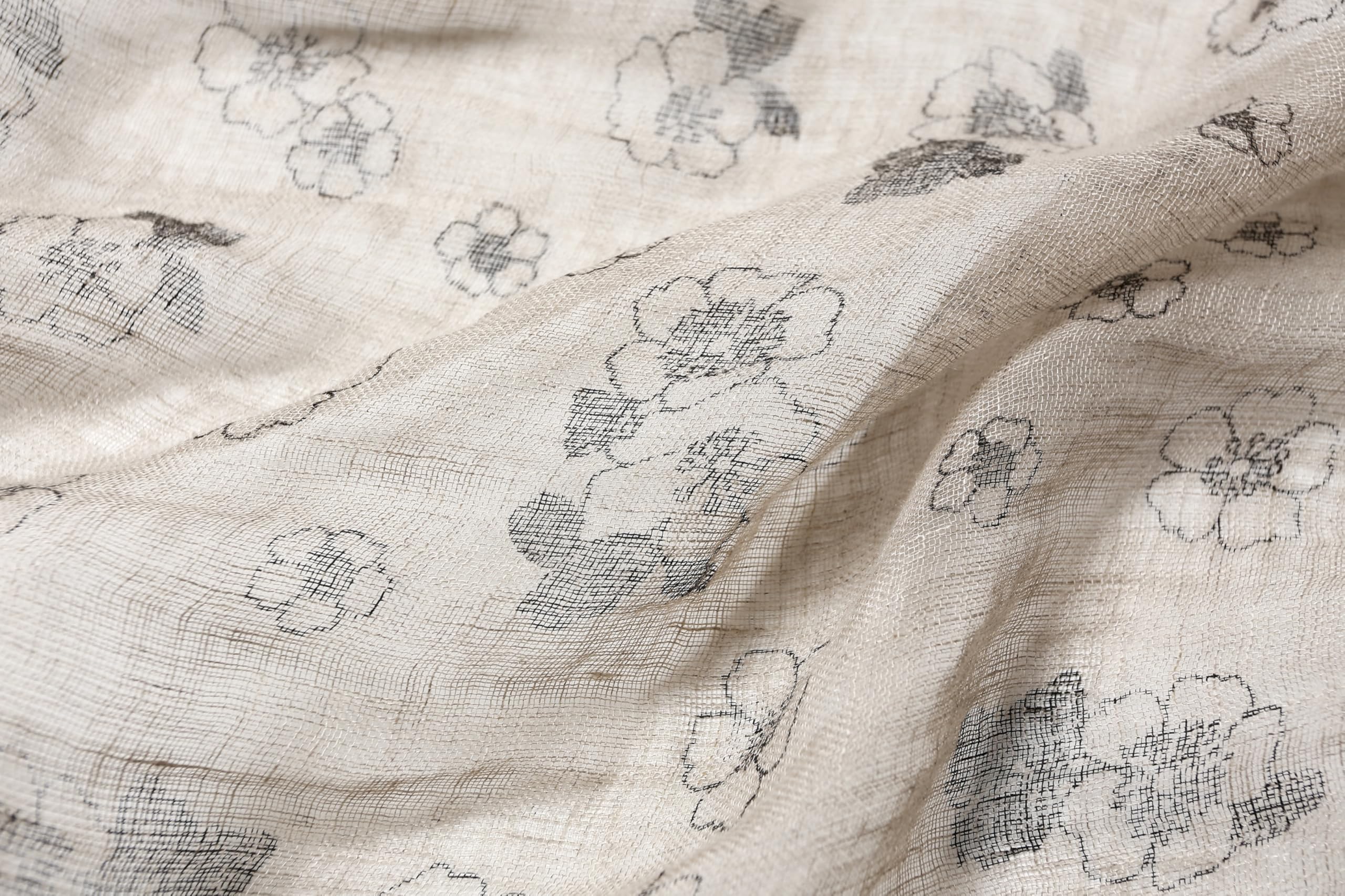 Ink floral linen scarf styled with a loose knot