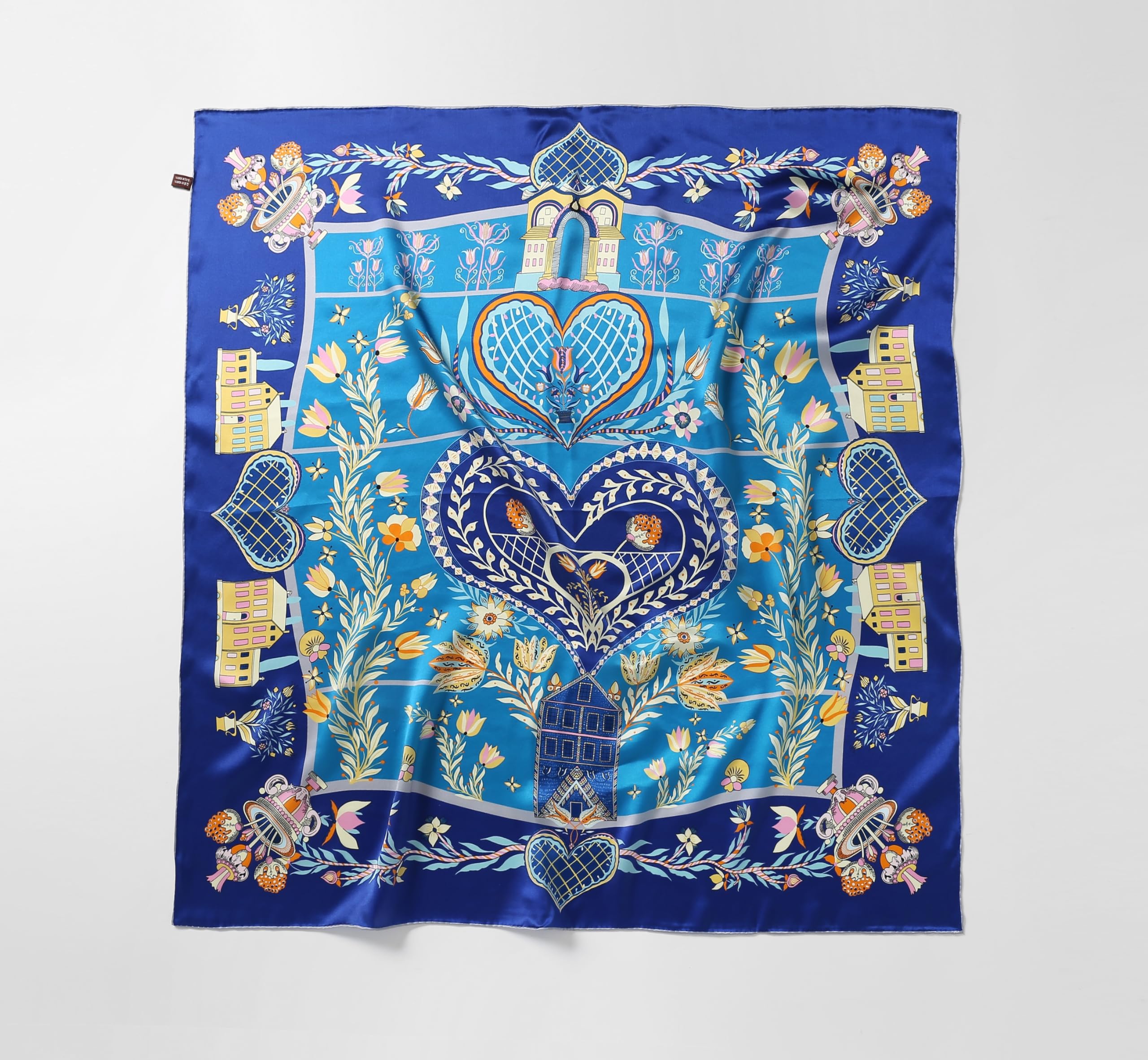 Flat view of the folk heart silk scarf showing the full symmetrical layout