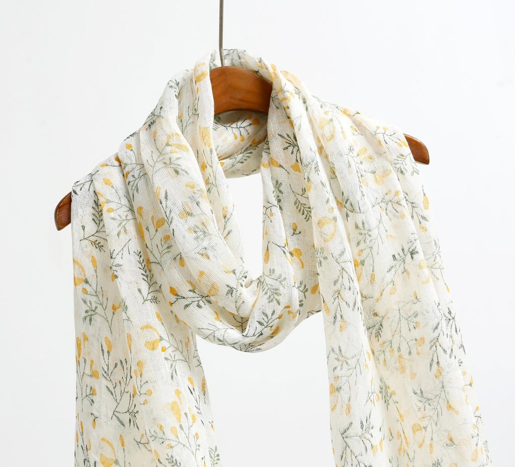 Detail of the frayed self fringe on the yellow botanical linen scarf