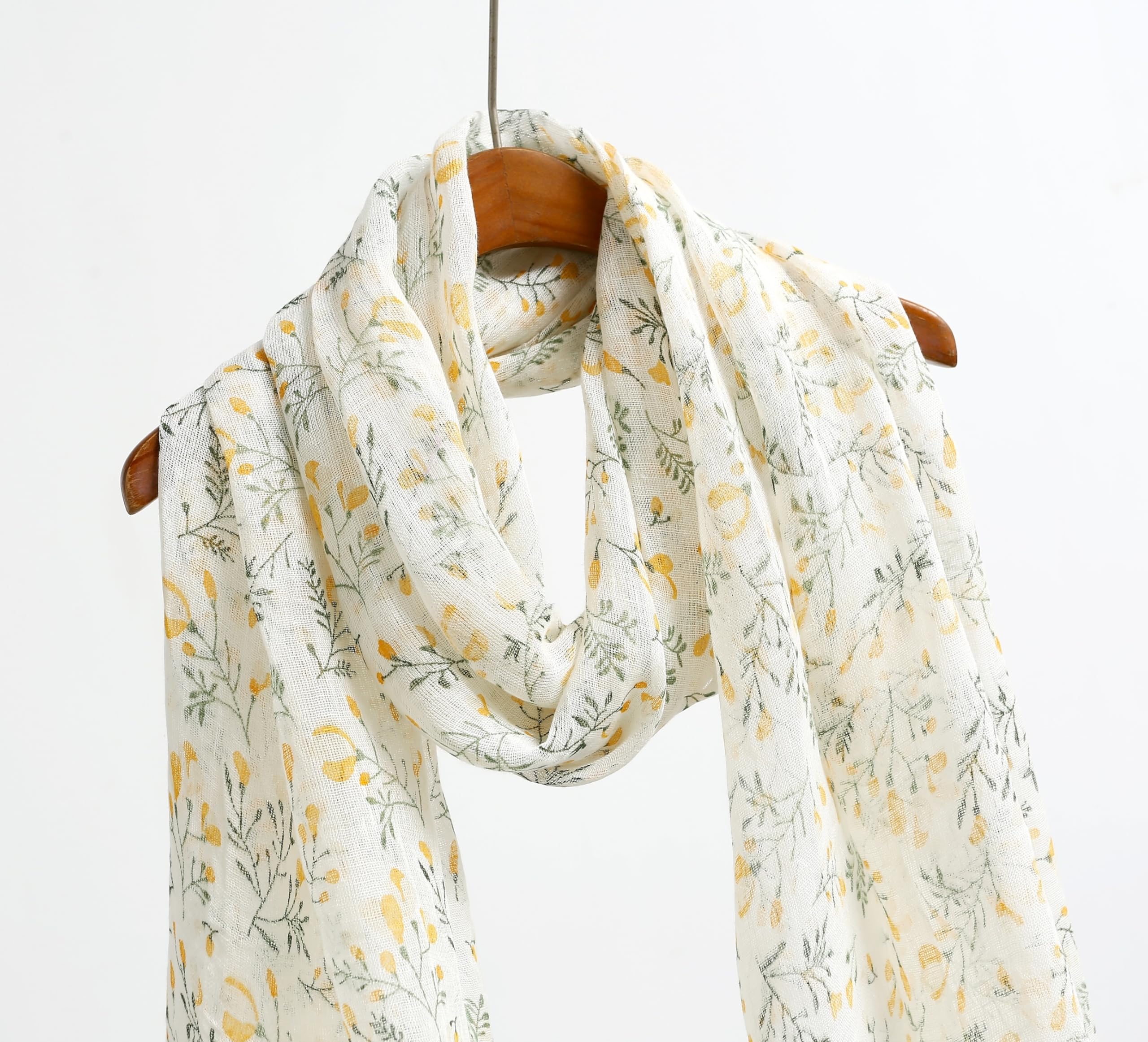 Detail of the frayed self fringe on the yellow botanical linen scarf
