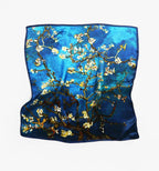 The full square flat, white almond blossom on brown branches over cerulean blue