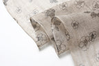 Ink floral linen scarf open as a shoulder wrap