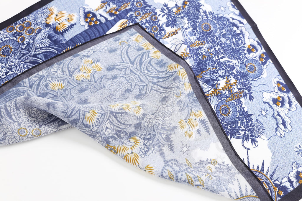 Fold detail, gold seed pods and blue engraving meeting the black border band