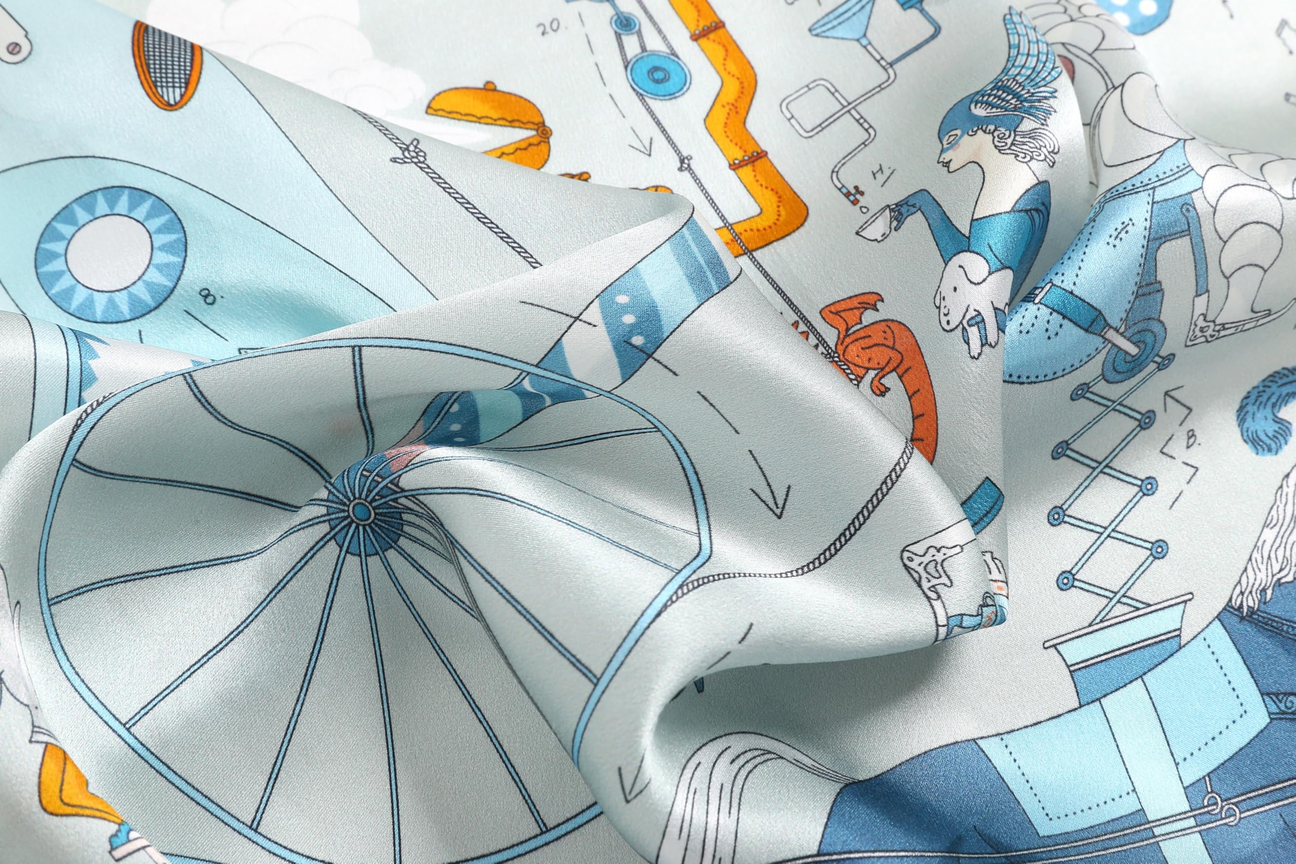 Soft folds of pale blue silk over the big spoked wheel and an orange balloon