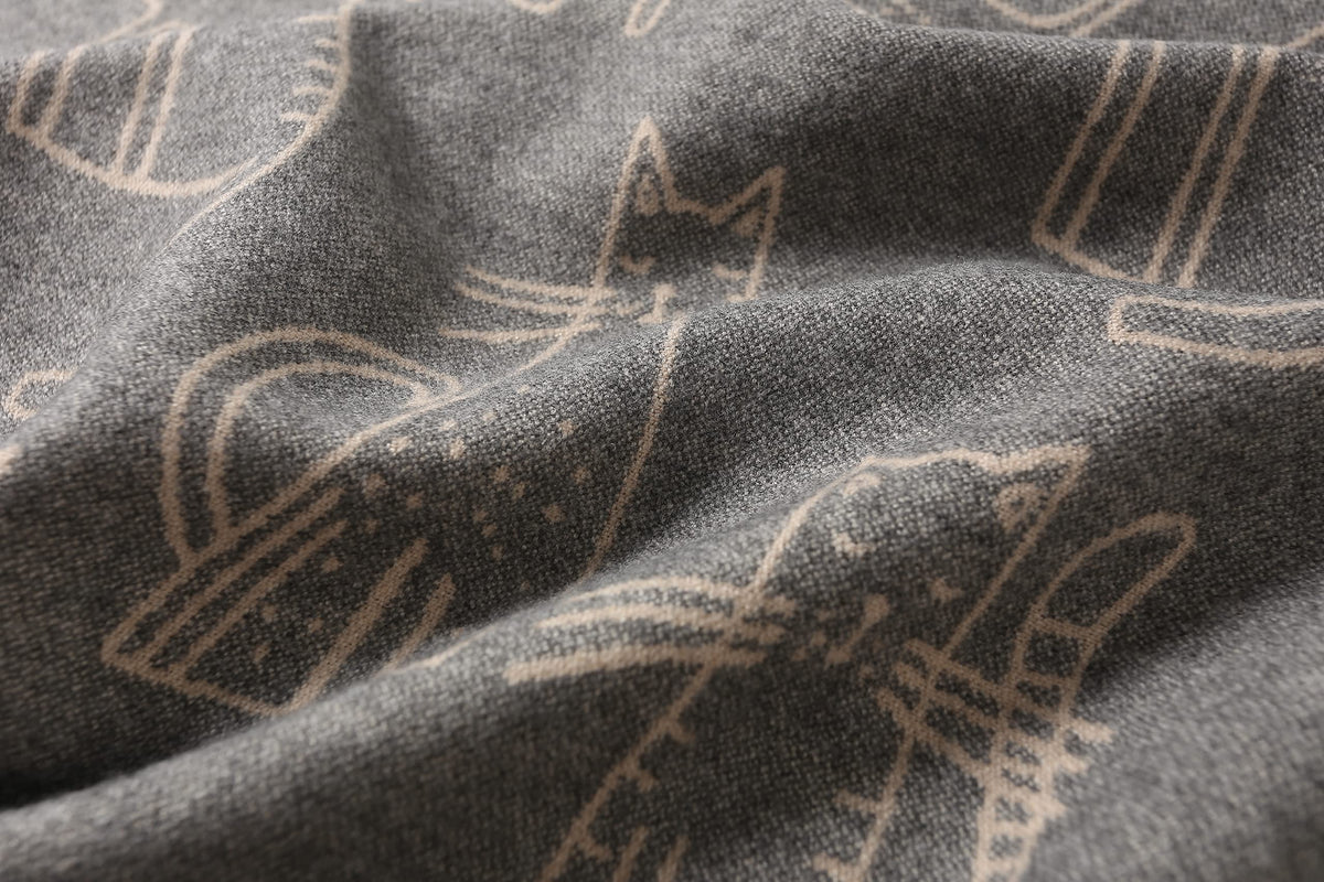 Blue grey doodle cat shawl styled with a winter coat