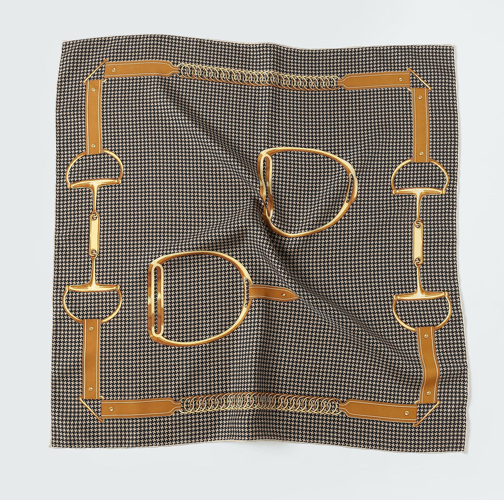 Flat view of the brown houndstooth silk square showing the gold chain and stirrup border