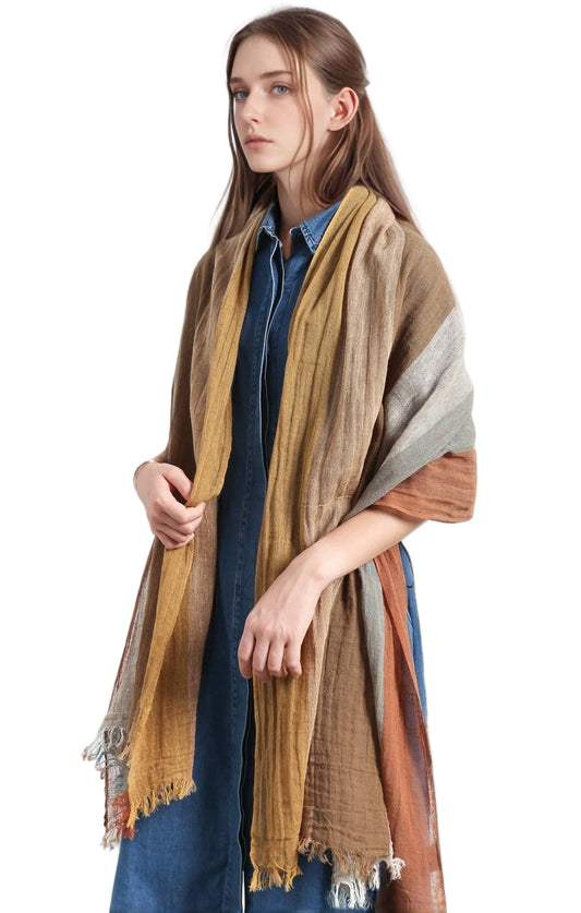 Woman wearing a patterned scarf on a white background