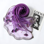 Gray Jeelow scarf shown with metallic woven border detail