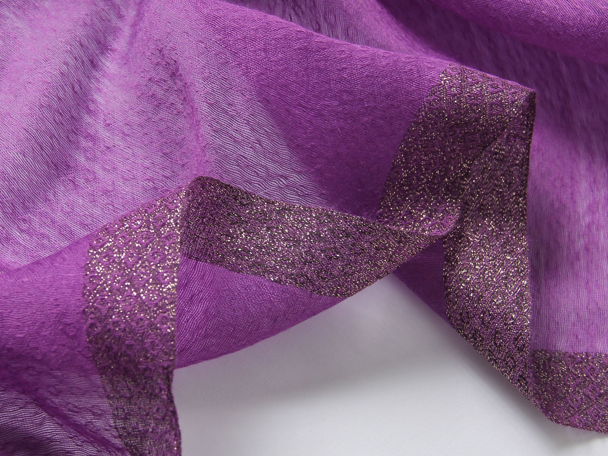 Deep purple Jeelow scarf shown with metallic woven border detail