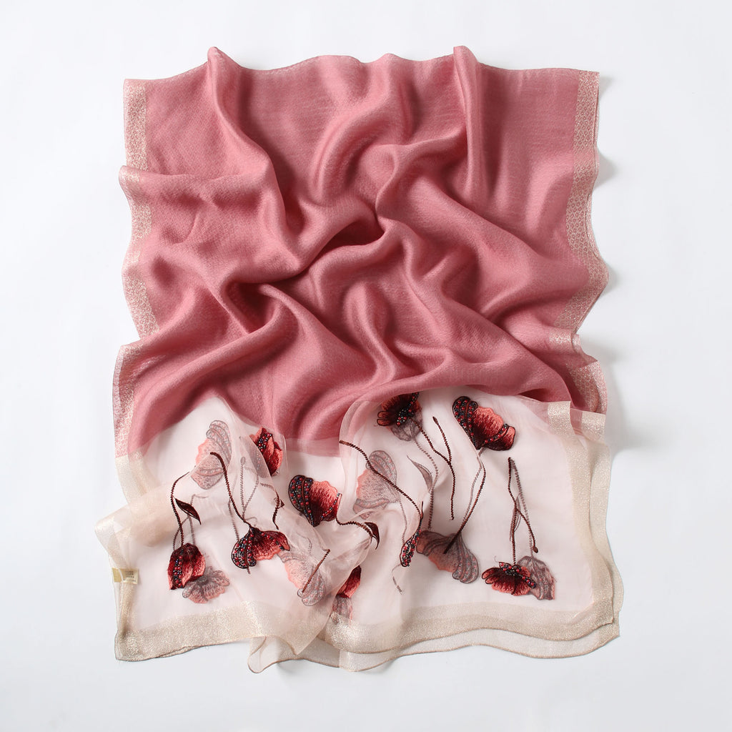 Long semi-sheer blush pink wrap with embroidered poppies — model view