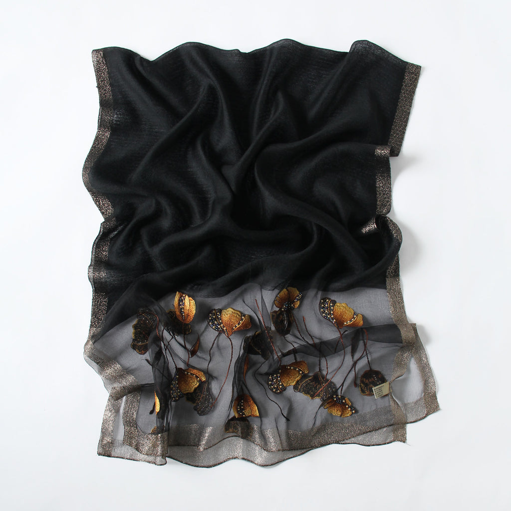 Black Jeelow scarf shown with metallic woven border detail