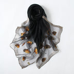 Long semi-sheer gray wrap with embroidered poppies — model view