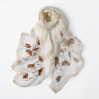 Gray embroidered poppy scarf with beaded centers, draped view