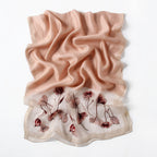 Blush pink embroidered poppy scarf with beaded centers, draped view