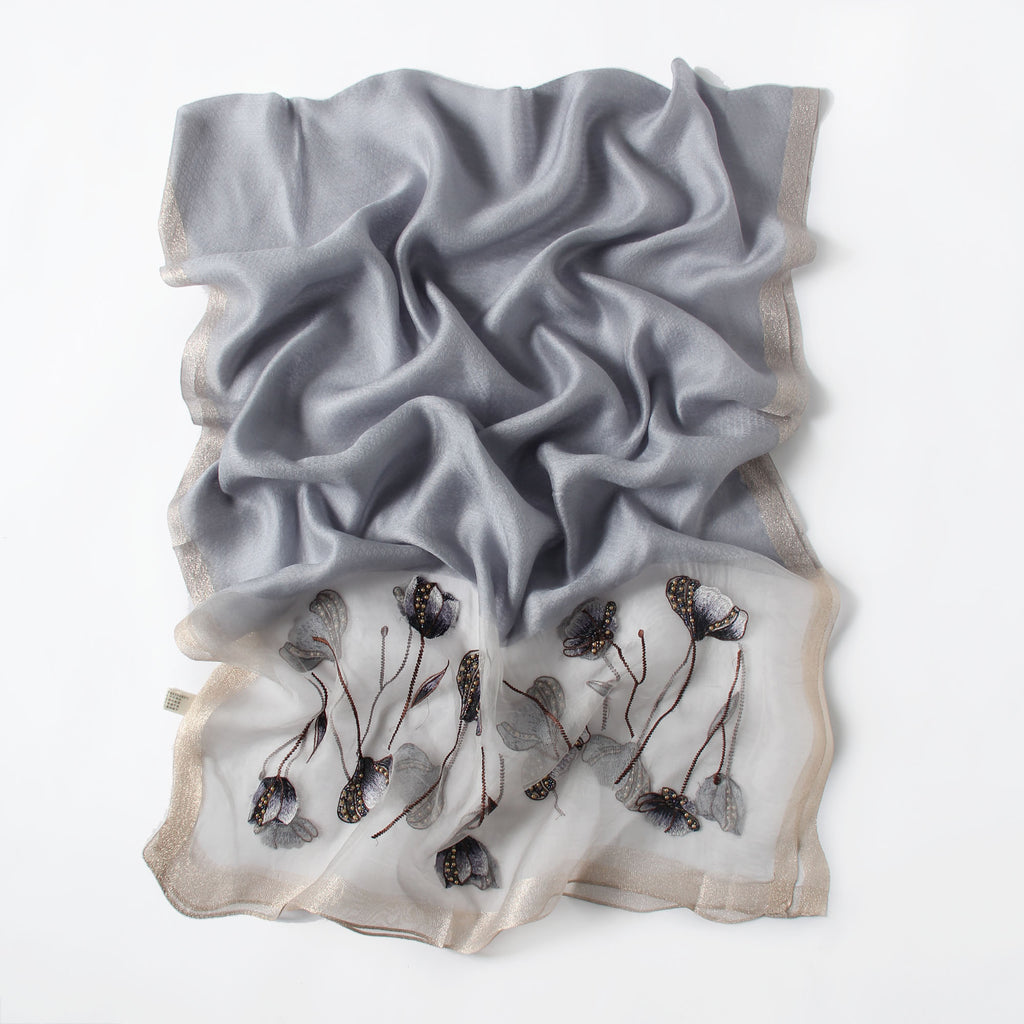 Gray Jeelow scarf shown with metallic woven border detail