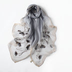 Long semi-sheer gray wrap with embroidered poppies — model view