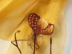 Long semi-sheer champagne wrap with embroidered poppies — model view