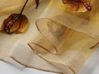 Champagne embroidered poppy scarf with beaded centers, draped view